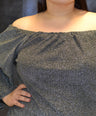 Blusa brillosa off the shoulders
