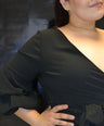 Blusa pemplum con laso