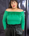 Blusa con plumas off the shoulders