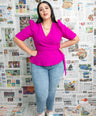Blusa pemplum con lazo