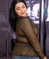 Blusa tela brillosa semitransparente