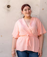 Blusa pemplum con lazo