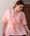 Blusa pemplum con lazo