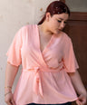 Blusa pemplum con lazo